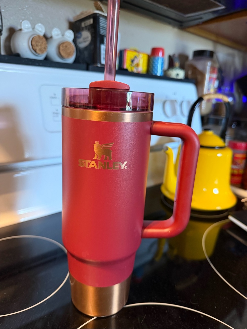 Stanley Red Travel Tumbler with Gold Base and Handle